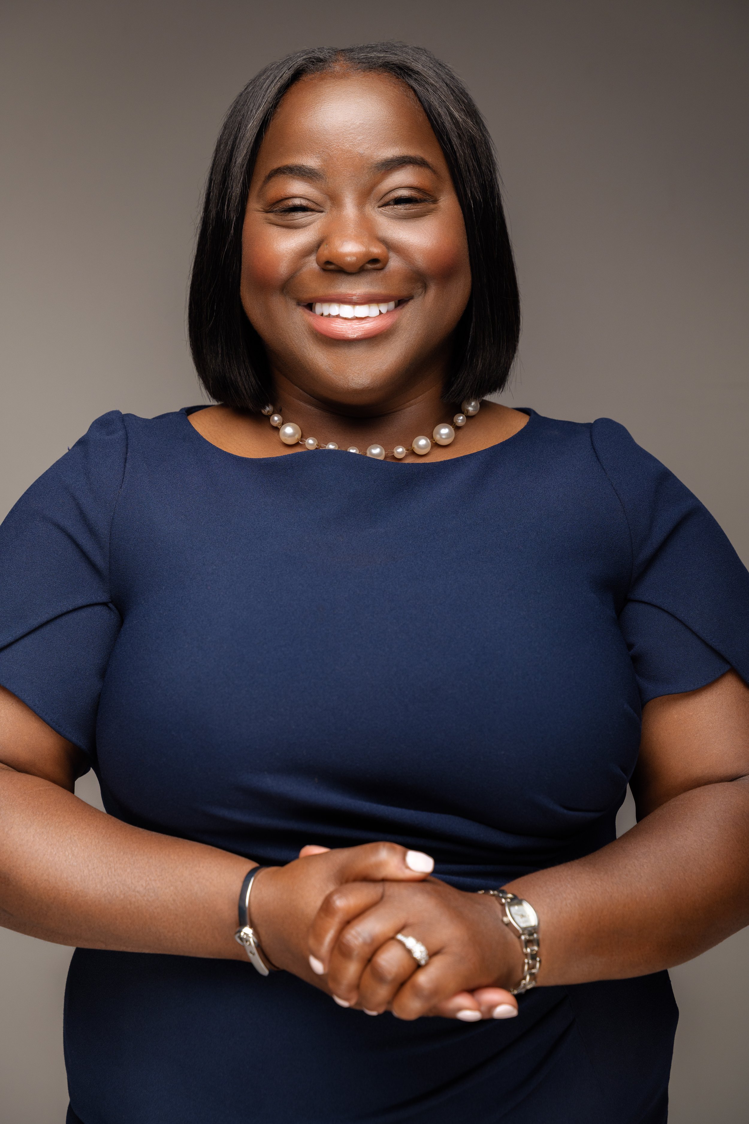 Adrienne McFarland smiling, photographed in the 6th Ward.